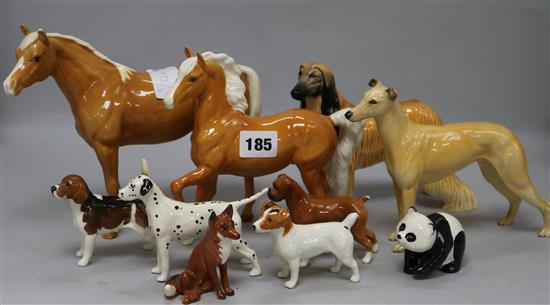 A collection Beswick dogs and horses and other animals